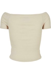 Ljus beige räfflad topp med avtagna axlar, korta ärmar, figursydd design och en slät textur; har en enkel, klassisk siluett.