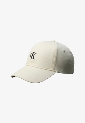 Cappellino da baseball color panna con visiera curva e logo "cK" ricamato in nero sul pannello frontale.