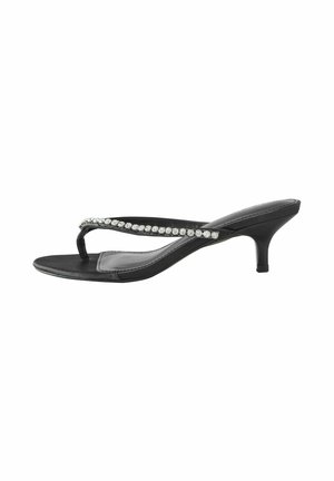Schwarze Absatzsandalen mit einem dünnen Riemen und Zehensteg, verziert mit einer Reihe klarer Strasssteine entlang des Oberteils. Glatte, glänzende Textur.