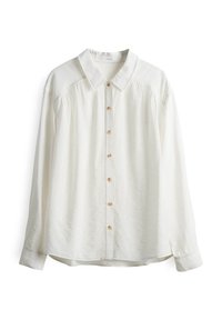 Camicia bianca a maniche lunghe realizzata in tessuto morbido, con colletto a punta, apertura con bottoni e dettagli arricciati sulle spalle.