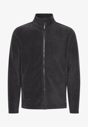 Chaqueta de forro polar negra con un cuello alto, cremallera frontal y bolsillos laterales. Textura suave con un diseño simple. Sin patrones ni acentos visibles.