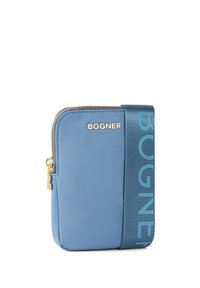 Blue leather crossbody bag with a gold zipper, featuring a wide fabric strap embossed with "BOGNER." Smooth texture, compact rectangular shape.