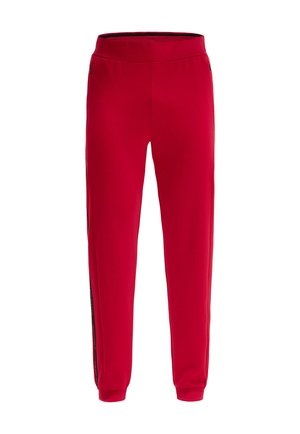 Red athletic pants with a smooth texture, elastic waistband, and contrasting side zippers for style. Tapered fit with cuffed ankles.