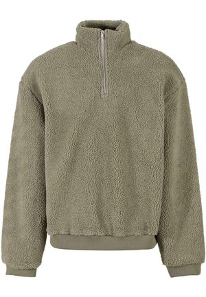 Fleece pullover in olijfgroen met een halve rits. Textuur aan de buitenzijde en geribde manchetten en zoom. De relaxed fit zorgt voor comfort.