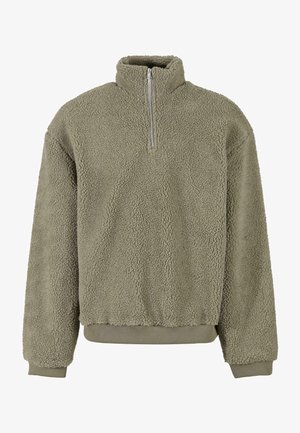 Fleece pullover i olivengrøn med en halvdels lynlås. Struktureret ydre og ribbede cuffs og kant. Den afslappede pasform tilføjer komfort.