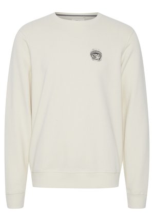 Cremfarbener Sweatshirt mit langen Ärmeln, gerippten Bündchen und Rundhalsausschnitt. Verfügt über ein kleines schwarzes Grafikdesign auf der Brust. Weicher Stoff.