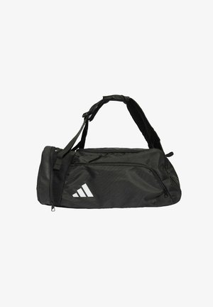 Sac de sport noir fabriqué en tissu durable, avec une fermeture éclair, une bandoulière ajustable et un logo blanc à trois bandes.