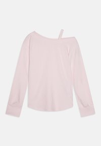 Light pink off-the-shoulder long-sleeve top, ribbed texture, with a single strap on one shoulder and cuffed sleeves.