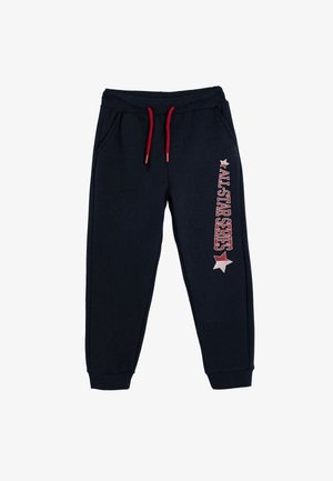 Marineblauwe trainingsbroek met een rode trekkoord, voorzien van witte en rode tekst "ALL-STAR SERIES" en een stergrafiek aan de zijkant.