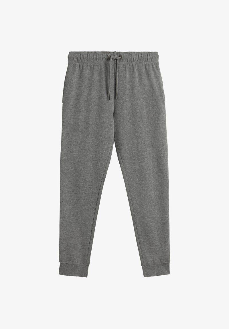 Szare dresy z elastycznym paskiem i sznurkiem, o zwężających się nogawkach i ściągaczach przy kostkach. Miękka faktura materiału.