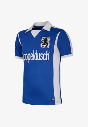 Blauw voetbalshirt met een witte kraag, contrasterende witte zijpanelen, een leeuwenembleem en de tekst "Doppel dusch" in het wit op de voorkant.