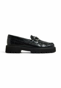 Black patent leather loafers with a crocodile texture, featuring a circular silver hardware detail and a chunky black rubber sole.