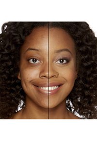 Split face of a person: left side shows natural skin texture with blemishes; right side features smooth, even skin with makeup, enhancing features.