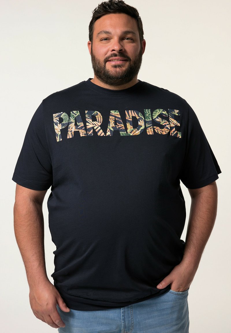 Námořnická modrá bavlněná trička se slovem "PARADISE" ve vzoru listů. Krátké rukávy a kulatý výstřih. Jednoduchý, uvolněný střih.