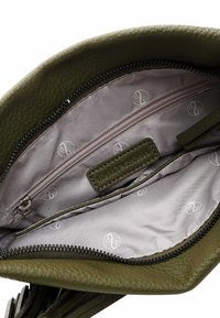 Green leather handbag with a textured finish, featuring a light fabric lining, zippered pocket, and logo pattern on the interior.