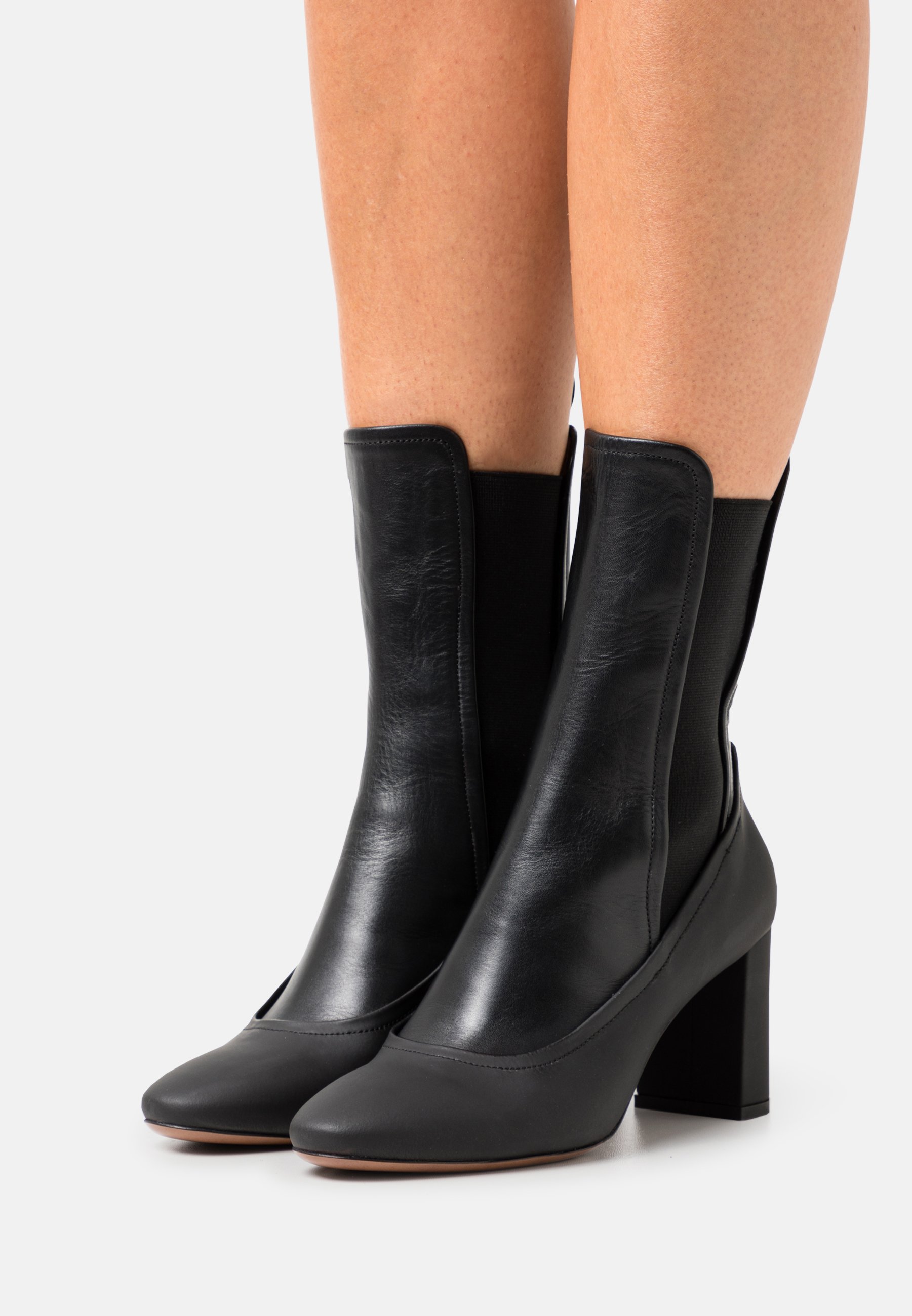 stretch black ankle boots