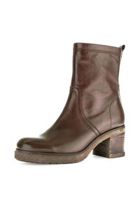 Bruine leren enkelboot met een ronde neus, verhoogde stikdetails en een chunky houten hak. Gestructureerde zool voor grip.