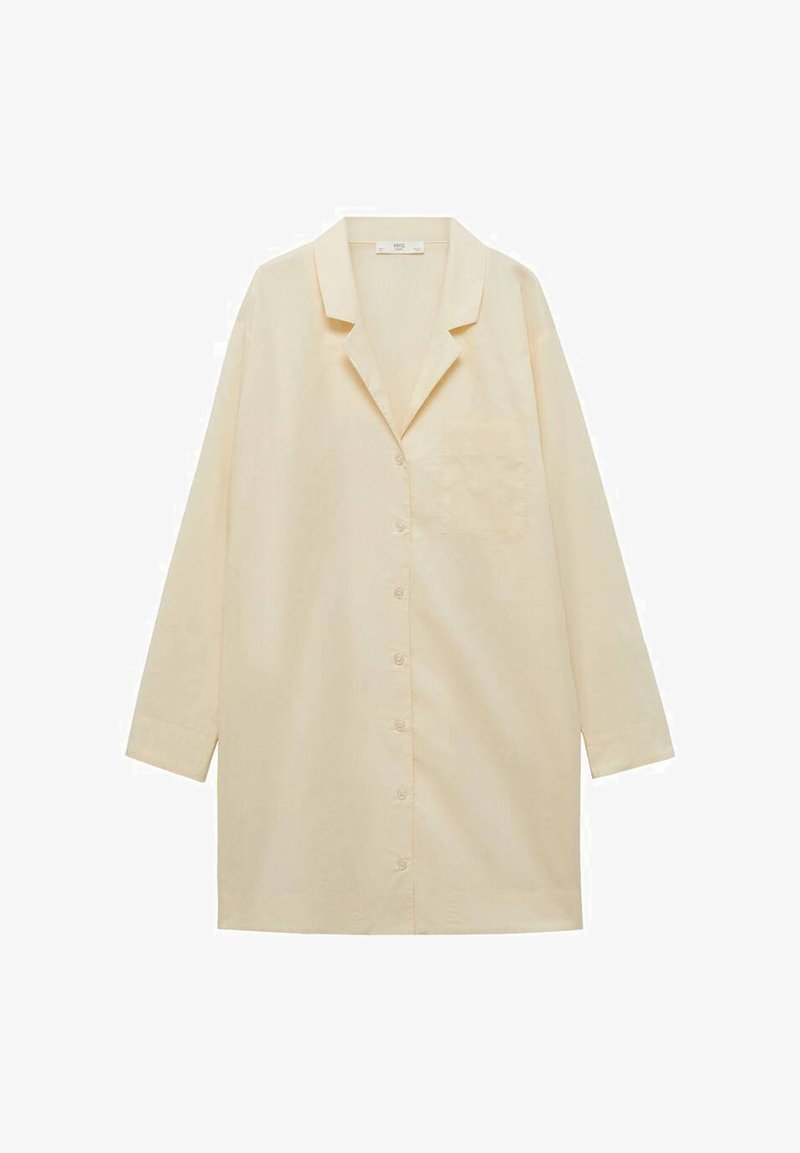 Cămașă button-up de culoare galben deschis, cu mâneci lungi, guler cu revere, un buzunar pe piept și textură netedă din bumbac.