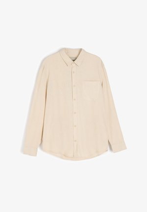 Beżowa, długosleeve koszula zapinana na guziki, wykonana z fakturowanej tkaniny, z kołnierzykiem, kieszonką na piersi i zaokrąglonym dołem.