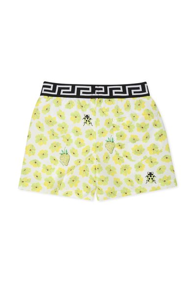 Costume da bagno con una base bianca decorata da un motivo floreale giallo, fragole verdi e ricami di coccinelle nere. Vita nera con design a chiave greca.