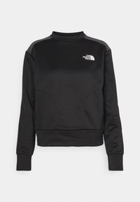 Felpa nera realizzata in materiale morbido, con collo alto, maniche lunghe, design con pannelli laterali e un piccolo logo bianco sul petto.