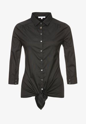 Chemise noire à manches longues avec boutons, col, petit détail en forme d'abeille dorée sur le bouton supérieur et nœud à l'avant à la taille.