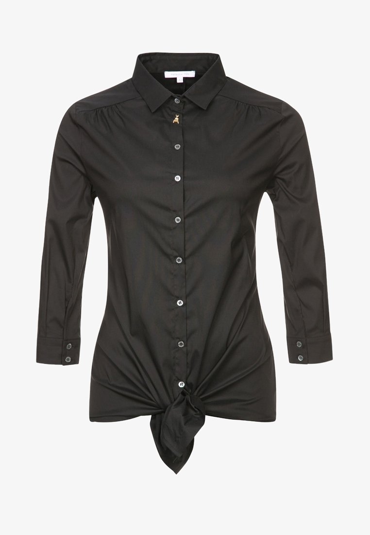 Chemise noire à manches longues avec boutons, col, petit détail en forme d'abeille dorée sur le bouton supérieur et nœud à l'avant à la taille.