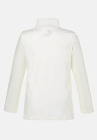 Langarm-Polohemd aus cremefarbenem Stoff mit Kragen und dezentem Logodesign auf der Rückseite. Flache Nähte und weiche Textur.