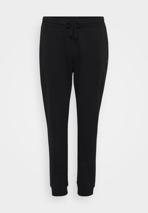 Black sweatpants with a drawstring waistband, tapered legs, and ribbed cuffs. Made from soft cotton fabric with a smooth texture.