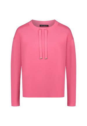 Różowy sweter z okrągłym dekoltem, długimi rękawami i dwoma sznurkami z przodu. Wykonany z gładkiego materiału o minimalistycznym designie.