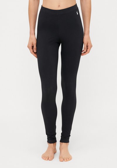 Sorte leggings lavet af strækbart stof, med et tætsiddende design, elastisk talje og en lille logo detalje på venstre side.