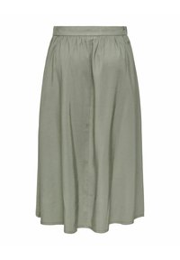 Jupe trapèze vert clair longueur genou avec taille froncée et texture de tissu lisse, présentée sur fond blanc.