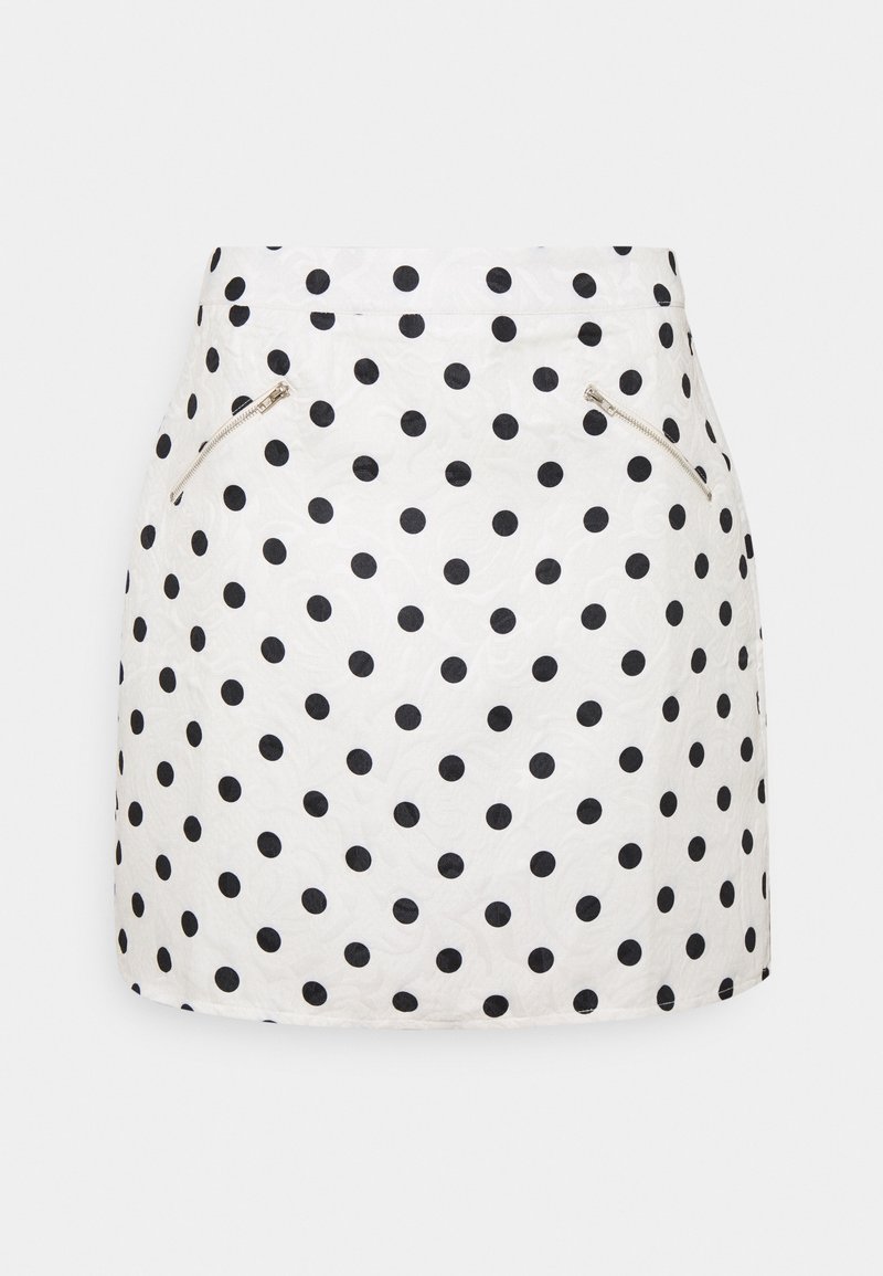 White skirt featuring black polka dots, with a smooth texture. Includes two zippered side pockets and a straight hemline.