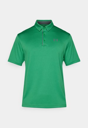 Grünes Poloshirt aus strukturierter Stoffqualität mit klassischem Kragen, drei Knöpfen und einem kleinen lila Logo auf der linken Brust.