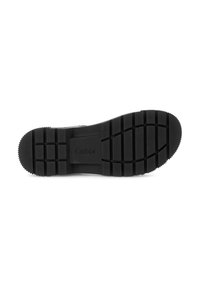 Black rubber shoe sole with a textured, tread pattern. Features grooves and a rounded toe, with branding visible in the center.