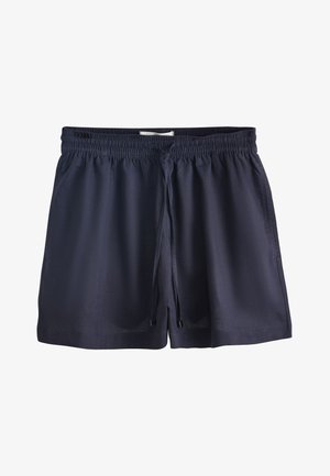 Donkerblauwe shorts met elastische taille en een trekkoord aan de voorkant, gemaakt van lichtgewicht stof, plat liggend op een witte achtergrond.
