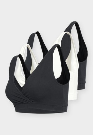 Set de patru sutiene sport wireless, fără mâneci, în negru și alb, cu bretele late și design cu decolteu adânc în V.