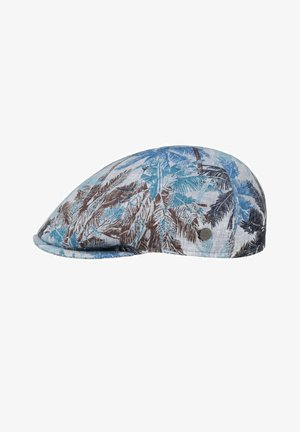 Flat cap with blue, brown, and black tropical leaf pattern on light fabric, showing a small round metallic brand tag on the side.