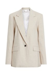 Blazer beige in lino con rever a smeraldo, chiusura a un bottone, due tasche frontali e una fodera interna liscia. Design leggero e su misura.