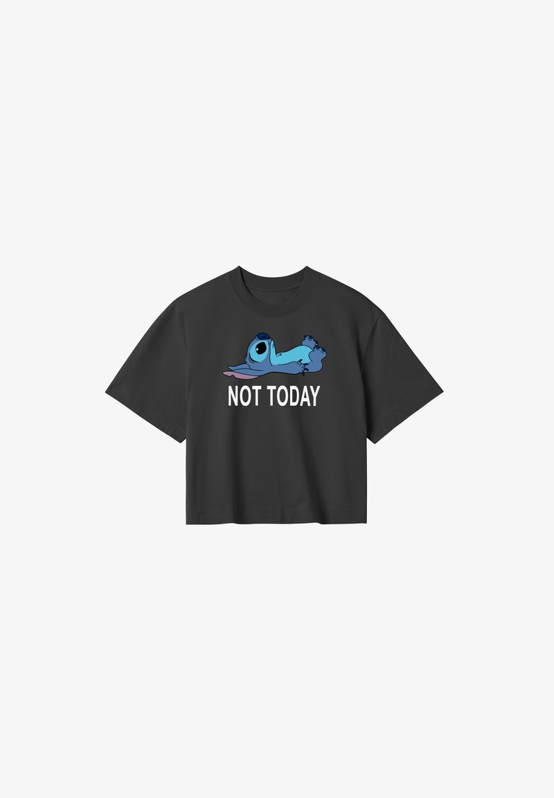 Camiseta negra recortada con un personaje de dibujos animados azul que tiene ojos grandes y el texto "NO HOY" en blanco debajo. Material de algodón.