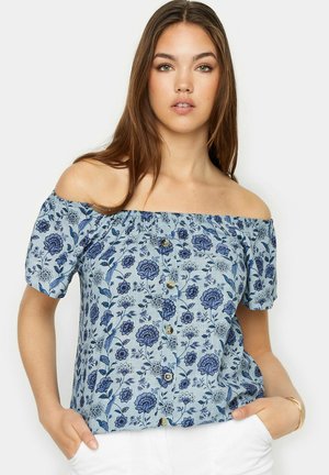 Blusa blu off-the-shoulder con motivo floreale, maniche a sbuffo corte e chiusura a bottoni sul davanti. Tessuto leggero con un aspetto testurizzato.