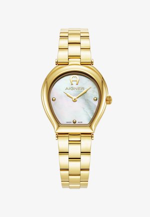 Reloj metálico dorado con caja ovalada, dial de nácar y manecillas doradas. Presenta una pulsera de eslabones dorada y el logo de Aigner a las 12 en punto.