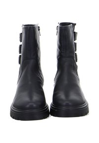 Schwarze Knöchelboots aus glattem Leder. Mit runder Zehenpartie, seitlichen Reißverschlüssen und drei dekorativen Riemen an der Außenseite. Robuste Gummisohle.