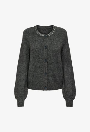 Pilka megztinė su apvaliu kaklu, papuoštu apykakle, šešiais juodais mygtukais ir ilgomis, šiek tiek pūstomis rankovėmis.