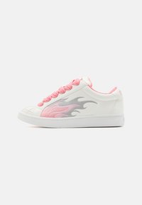 White sneaker with woven pink laces, silver flame design on side, textured toe cap, and pink accents around the collar and heel.