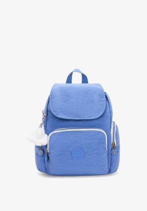 Blue fabric backpack with a flap closure, front zip pocket, logo patch, and plush charm detail. Textured surface and adjustable straps.