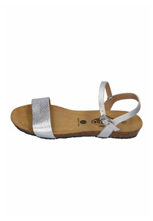 Silver open-toe flat sandal with a single front strap, ankle strap with buckle, and cork sole.