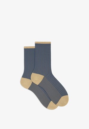Calzini a costine blu scuro con accenti dorati sul polsino e sulle punte, caratterizzati da una texture liscia e strisce orizzontali a contrasto.