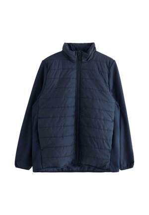 Giacca imbottita blu navy con colletto alto, chiusura frontale con zip, motivo trapuntato sulla parte superiore anteriore e tessuto solido sulle maniche.