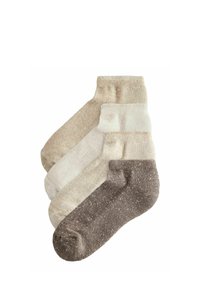 Vier Paar Socken in verschiedenen Beigetönen und Braun, mit einer gesprenkelten Textur und gerippten Bündchen, hergestellt aus weichem Material.